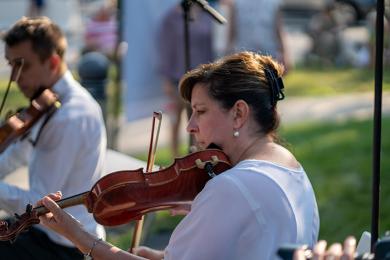 Kristen Wiersma plays violin with the Illinois Philharmonic Orchestra String Quartet on Wednesday, Aug. 18, in front of the Flossmoor Public Library during Chamber Night. (BC)