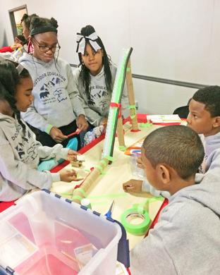 This Flossmoor Hills School fifth grade team of, from left, Nevani Bell, Mary-Kathleen Stalling, Emoni Brown, Cameron Brooks and Jovohn Ratliff uses imagination to build a roller coaster. (MT)