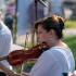 Kristen Wiersma plays violin with the Illinois Philharmonic Orchestra String Quartet on Wednesday, Aug. 18, in front of the Flossmoor Public Library during Chamber Night. (BC)