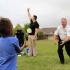 Homewood Deputy Police Chief Rick Sewell tosses a water balloon to his partner.