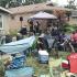 Audience members sit in lawn chairs as Mad Tea performs on Palmer Avenue in Homewood. (NJ)