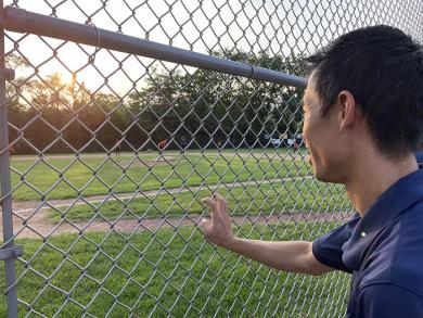 Bronco League Commissioner James Cheung takes in some of the action of the third-place game. (BJ)