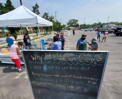 A chalkboard at the Homewood composting event invited visitors to write messages saying what they planned to do with their compost. (EC)