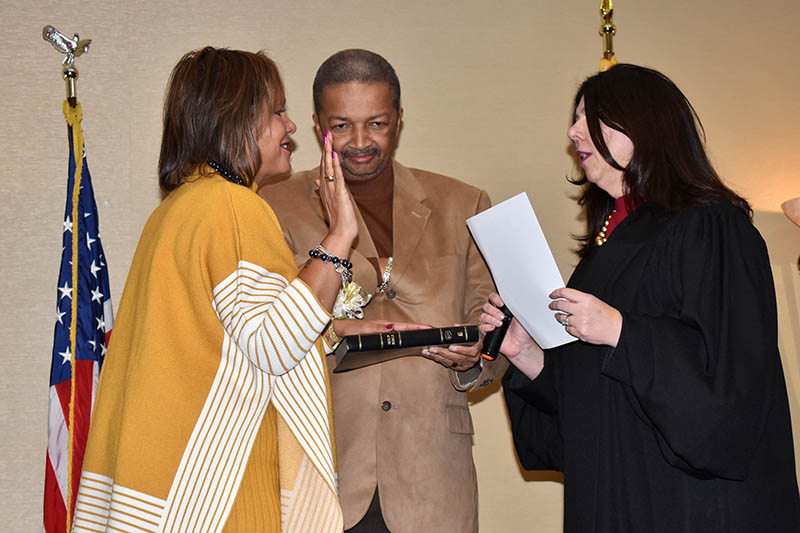 Congresswoman Robin L. Kelly is sworn in as representative for the 2nd Congressional District of Illinois. The oath of office is administered by the Honorable Anna Demacopoulos. Holding the bible is Kelly's husband, Dr. Nathaniel Horn. (Mary Compton/H-F Chronicle)