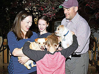 The O'Shea family with their pets. The most recent addition is The Colonel, left.