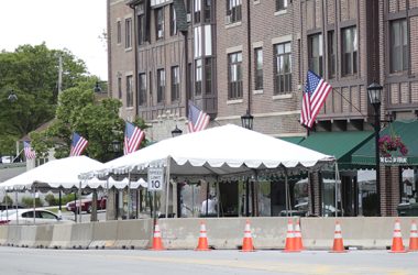 A photo from June 2020 shows the early days of outdoor dining in Flossmoor, started during the pandemic to help restaurants weather the crisis. Flossmoor extended the authorization for outdoor dining, but restaurants will no longer be able to use parking spaces for tables. The reconfiguration of sidewalk space is expected to better accommodate diners. (Chronicle file photo)