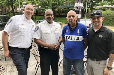 Resident Leonard Harris, third from left, of the Flossmoor Hills Civic Association, met up with Flossmoor police, from left, Deputy Chief Clint Wagner, Commander Keith Taylor and Officer David Levy at the Coffee with a Cop event Friday, May 20. (Marilyn Thomas/H-F Chronicle)