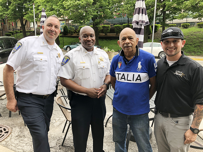 Resident Leonard Harris, third from left, of the Flossmoor Hills Civic Association, met up with Flossmoor police, from left, Deputy Chief Clint Wagner, Commander Keith Taylor and Officer David Levy at the Coffee with a Cop event Friday, May 20. (Marilyn Thomas/H-F Chronicle)