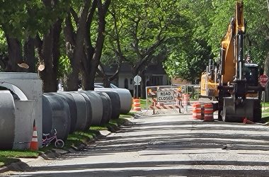 Drainage pipes are ready to be installed, but equipment is parked as a quarry strike has stopped work on the Berry Lane drainage project in Flossmoor. (Eric Crump/H-F Chronicle)