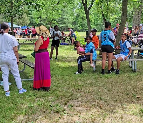 People from Homewood, Flossmoor and nearby communities gather at Izaak Walton Nature Preserve on July 4 for an old fashioned community picnic. (EC)