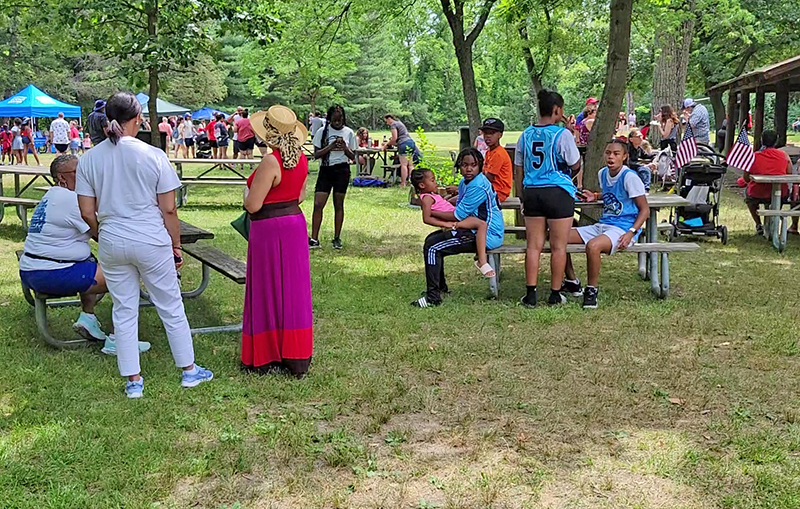 People from Homewood, Flossmoor and nearby communities gather at Izaak Walton Nature Preserve on July 4 for an old fashioned community picnic. (EC)