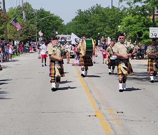 Members of the Stock Yards Kilty Band bring the sound of pipes and drums to the Homewood 4th of July parade. (EC)
