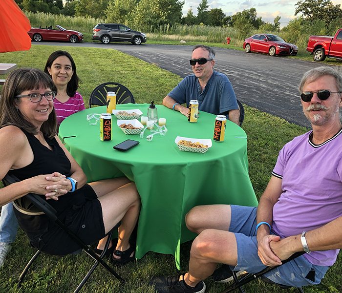 Summer Fest 3 Together on a summer's evening at Rabid Brewing for the Summer Fest benefit are from left Shelley Peck, Sharon Bouchie, George Bouchie and Matt Didier. (Marilyn Thomas/H-F Chronicle)
