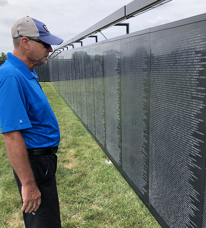 Jeff Angellotti of Crete was a visitor to the Wall That Heals on display at Marian Catholic High School. (Marilyn Thomas/H-F Chronicle)