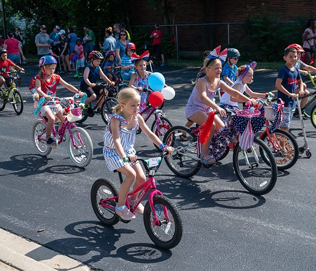 july4parade_220704_1 Young bikers ride in the Flossmoor 4th of July parade near Parker Junior High. (ABS)