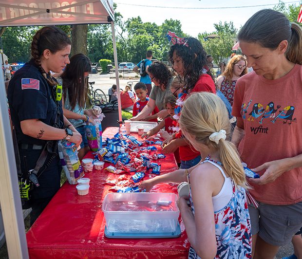 july4parade_220704_8 The Flossmoor Fire Department Volunteer Corporation hands out sweets, snacks and drinks to paraders after the Flossmoor 4th of July parade in downtown Flossmoor. (ABS)