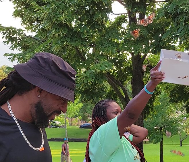 Alexis Wilson's parents, from left, Alonzo and Cara Wilson, release butterflies in the memory of their daughter. (Eric Crump/H-F Chronicle)