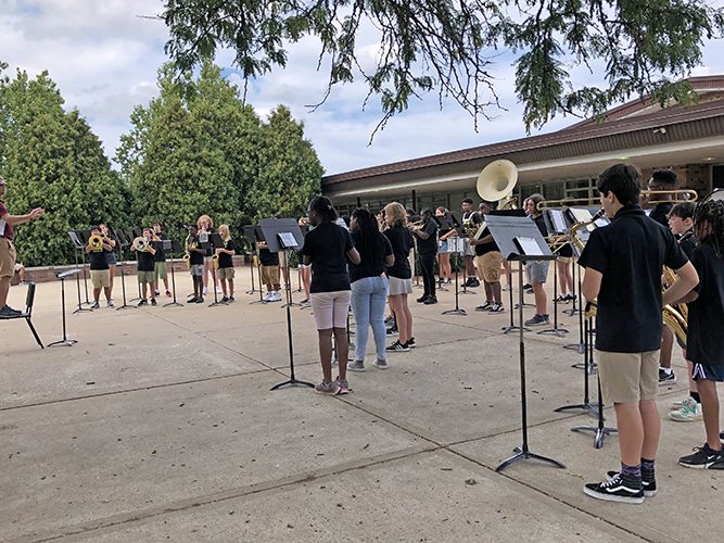 Band director Matt Johnson led the James Hart School band when the 50-member band performed four selections for guests at the Back to School event Aug. 27. (Marilyn Thomas/H-F Chronicle)