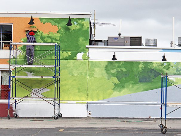 Thomas Melvin is in the early stages of painting "Independence Day" at the end of September 2014. (Eric Crump/H-F Chronicle)