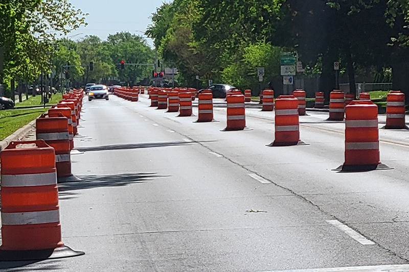 Barrels are used in May to test the effect of reducing 183rd Street from four lanes to two. The village is seeking a grant that would help with the costs of making that change permanent. (Chronicle file photo)
