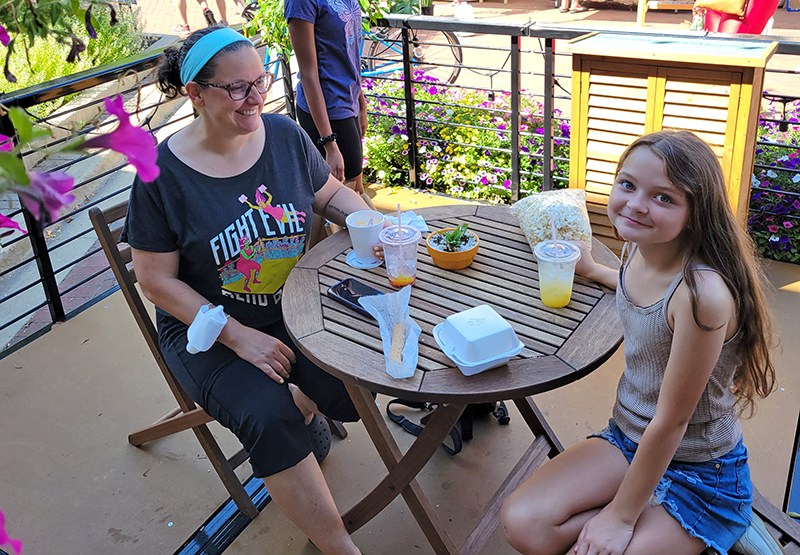 Jo Greep, left, in a "Fight Evil, Read Books" shirt, with her daughter and fellow bibliophile, Eleanor, talk about their disappointment at the news that Homewood's independent book store would be closing. (Eric Crump/H-F Chronicle)