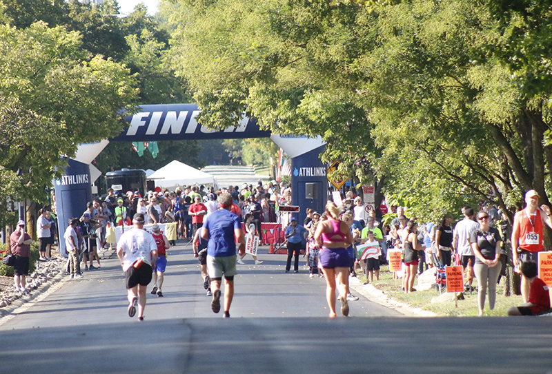 Runners on the last few yards of the half marathon race. (Eric Crump/H-F Chronicle)