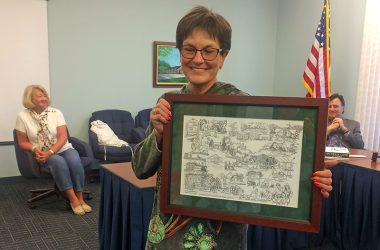 Sue Bertram holds a drawing she received from the H-F Park Board as a thanks for her 23 years of service. (Chronicle file photo)