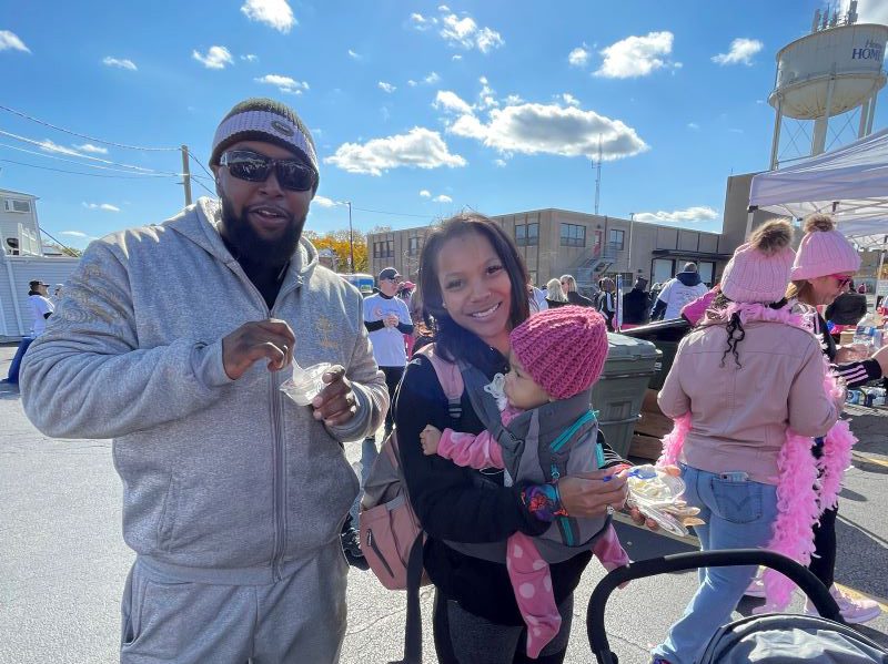 This family enjoys custard supplied by Culver's of Homewood for all the walkers. (Carole Sharwarko/H-F Chronicle)