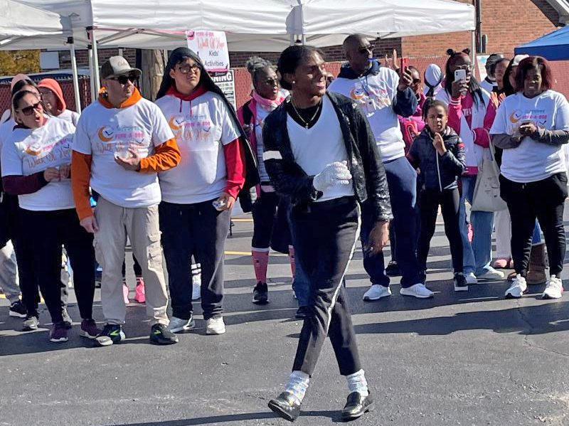 The crowd enjoys a performance by The Chosen One, a Michael Jackson dance impersonator. (Carole Sharwarko/H-F Chronicle)