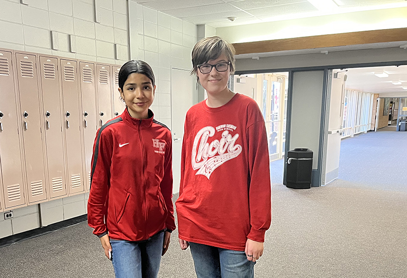 Sofia Leal, left, and Avery Hutson serve as tour guides for senior citizens during the annual breakfast event. (Nick Ulanowski/H-F Chronicle)