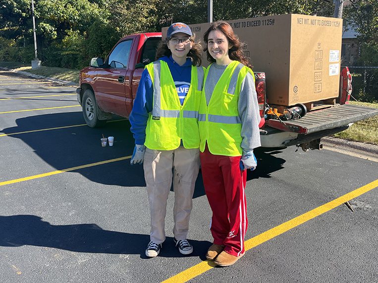 H-F High School students Celeste Carillo, left, and Anna Arrivo helped at Recyclepalooza. They said they’re working on a proposal for H-F school district to reduce its waste management. (Nick Ulanowski/H-F Chronicle)