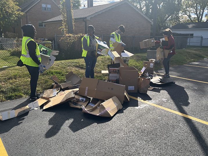 Volunteers break down the boxes during Recyclepalooza 2022. (Nick Ulanowski/H-F Chronicle)