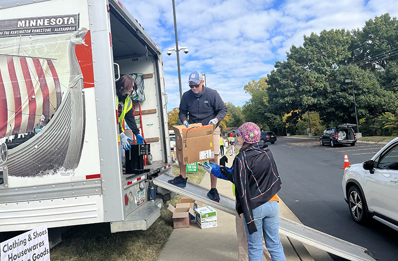 Volunteers load boxes of household items into truck during Recyclepalooza 2022. (Nick Ulanowski/H-F Chronicle)