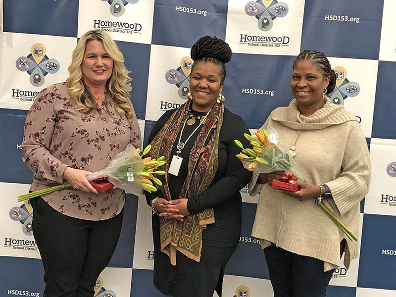 Melanie Mandisodza, center, congratulates Homewood District 153 school social workers Wendy Gatewood, left, and Tanya Duplessis, right, on completion of their Licensed Clinical Social Worker (LCSW) degrees. Not pictured is honoree Elizabeth Hackett. (Marilyn Thomas/H-F Chronicle)