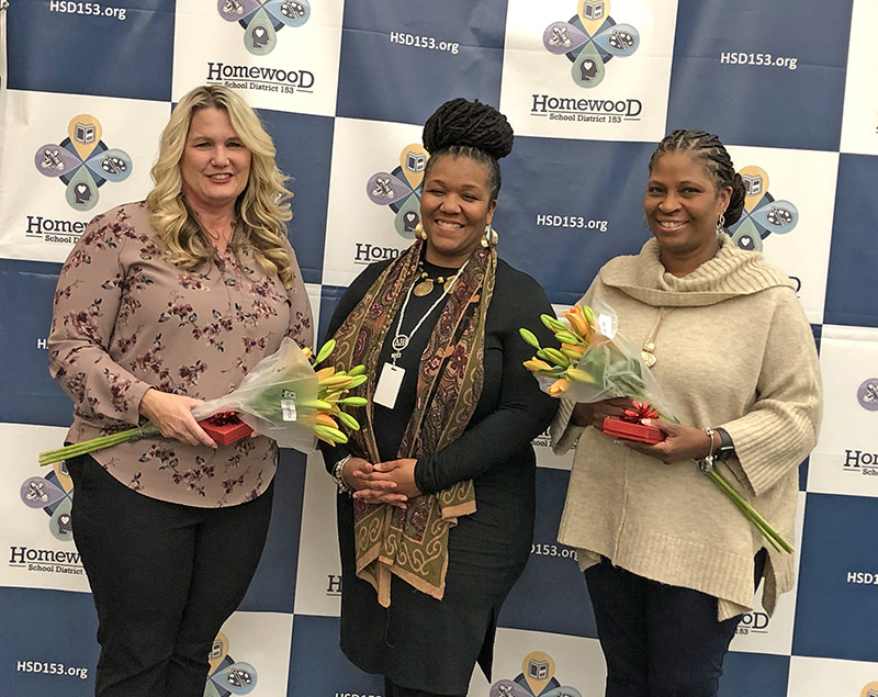 Melanie Mandisodza, center, congratulates Homewood District 153 school social workers Wendy Gatewood, left, and Tanya Duplessis, right, on completion of their Licensed Clinical Social Worker (LCSW) degrees. Not pictured is honoree Elizabeth Hackett. (Marilyn Thomas/H-F Chronicle)