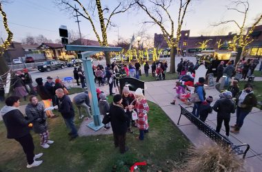 A crowd gathers on the south side of Flossmoor Public Library during the 2021 holiday festival and tree-lighting ceremony. (Chronicle file photo)