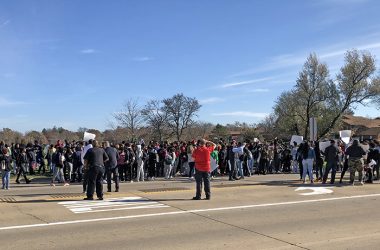 H-F High School students gather at the corner of Kedzie Avenue and Flossmoor Road on Thursday in a walkout intended to bring attention to safety issues at the school. (Marilyn Thomas/H-F Chronicle)