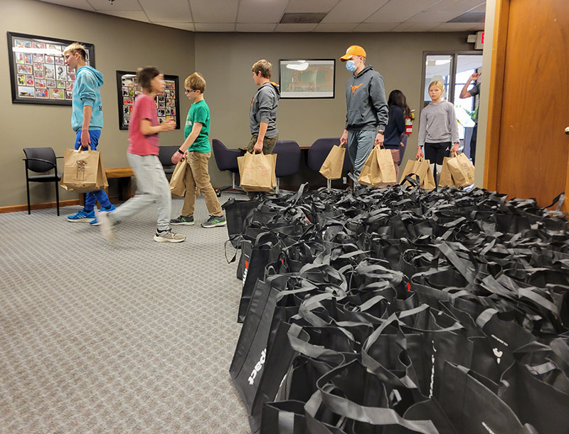 Volunteers from the First Reformed Church of South Holland help Open Access of Homewood organize bags of food in preparation for the organization's annual Thanksgiving dinner giveaway. (Eric Crump/H-F Chronicle)