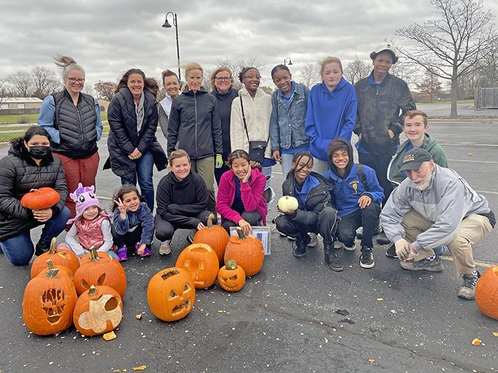 Organizers, volunteers and other community members out to smash pumpkins pose for a photo the morning of Saturday, Nov. 5, at Coyote Run Golf Course. (Bill Jones/H-F Chronicle)