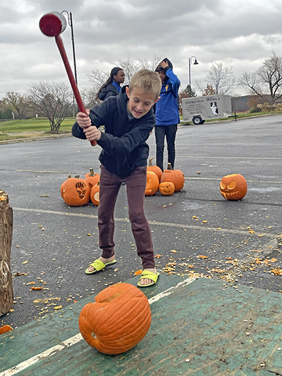 AJ Bruni, of Flossmoor, winds up for a big slam of the hammer on Saturday, Nov. 5, during the Pumpkin Smash at Coyote Run Golf Course. (Bill Jones/H-F Chronicle)