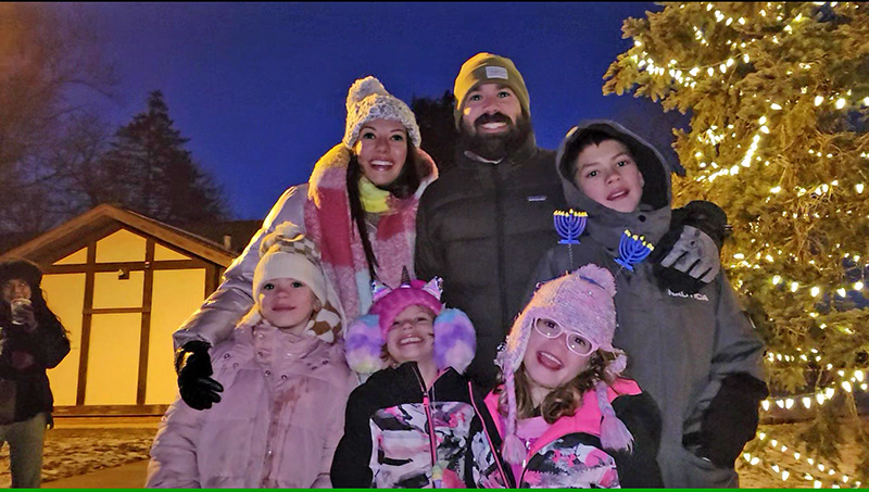 Charles Zurek, right, with his family, Christina Lutz, left, and David Zurek. Front row, siblings Naomi, Amara and Bianca. (Eric Crump/H-F Chronicle)