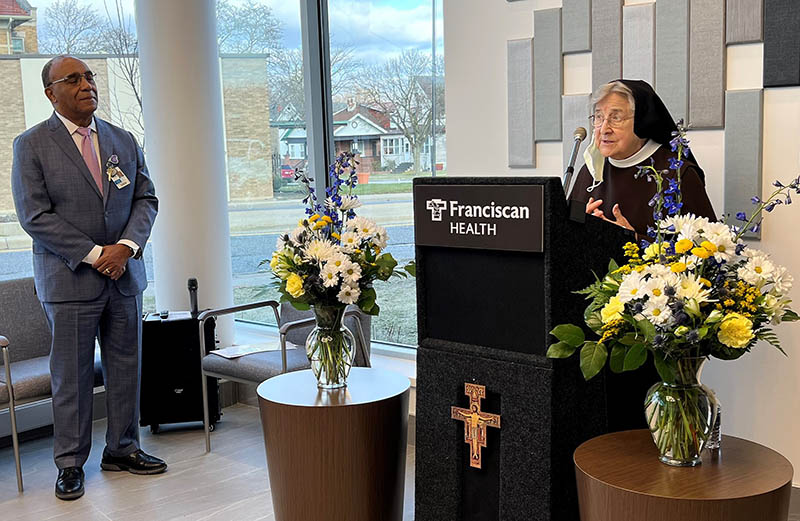 Sister Jane Marie Klein, chairwoman of the Franciscan Alliance Board of Trustees, right, speaks during a blessing and dedication ceremony on Nov. 30 for the new Family Medicine and Walk-In Clinic in Chicago Heights as Raymond Grady, president and chief executive officer of Franciscan Alliance’s South Suburban Chicago Division, looks on. (Provided photo)