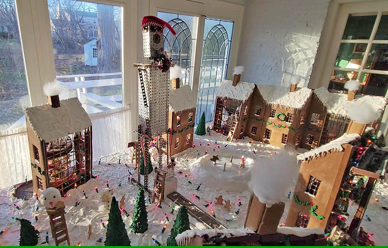 A giant created with an erector set looms over the gingerbread village scene. (Eric Crump/H-F Chronicle)