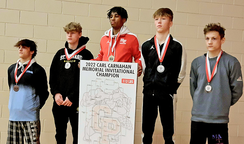 Deion Johnson holds his first-place bracket board at the Carnahan Invitational Dec. 17 in Crown Point, Ind. The win was part of a "get-back week" for the Homewood-Flossmoor senior. (Provided photo)