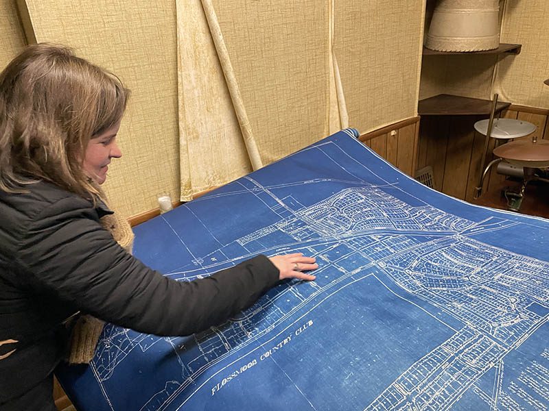 Mayor Michelle Nelson looks over a drawing of the village of Flossmoor produced in 1930. The Flossmoor historical society hopes to preserve documents like this. (Bill Jones/H-F Chronicle)