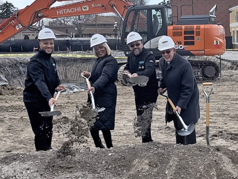From left, Homewood Brewery Company owners Brian Wallace, Carmela Wallace, Robert Lauderdale and Homewood Mayor Rich Hofeld dig in at the groundbreaking ceremony for Homewood Brewing. (Nick Ulanowski/H-F Chronicle)