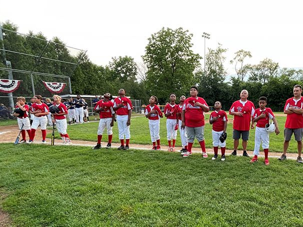 Members of the Phillies stand for the national anthem. (Bill Jones/H-F Chronicle)