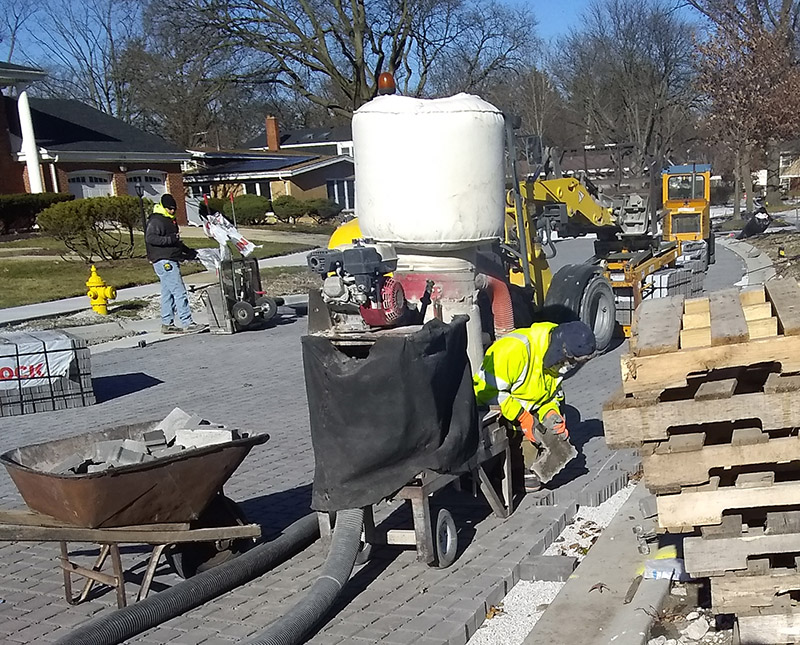 Workers install a surface of permeable pavers on Berry Lane during the first week of December. (Provided photo by Tom Houlihan)