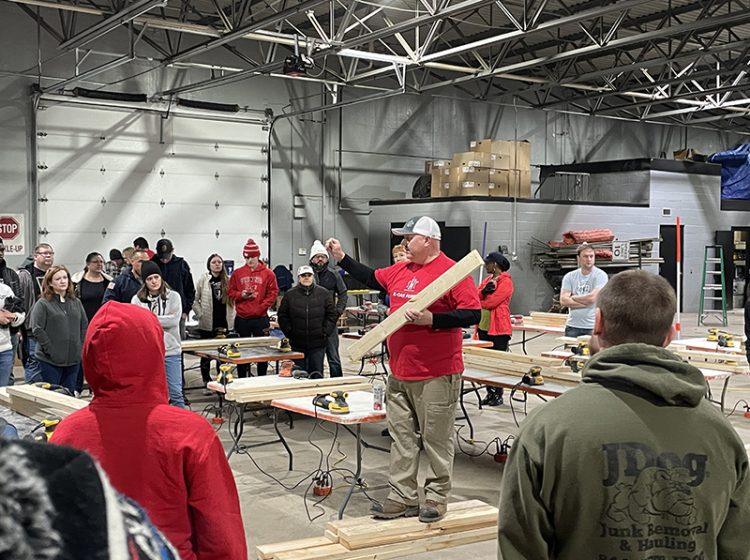 Mike O’Malley, a volunteer build manager for Sleep in Heavenly Peace, gives some instructions to start the day Saturday, Jan. 14, inside the Flossmoor Public Works garage. (Bill Jones/H-F Chronicle)
