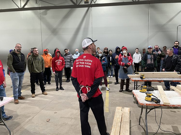Sleep in Heavenly Peace Oak Forest Chapter President Dave King gives a quick speech to a group of volunteers assembled Saturday, Jan. 14, in Flossmoor for a bed build. (Bill Jones/H-F Chronicle)
